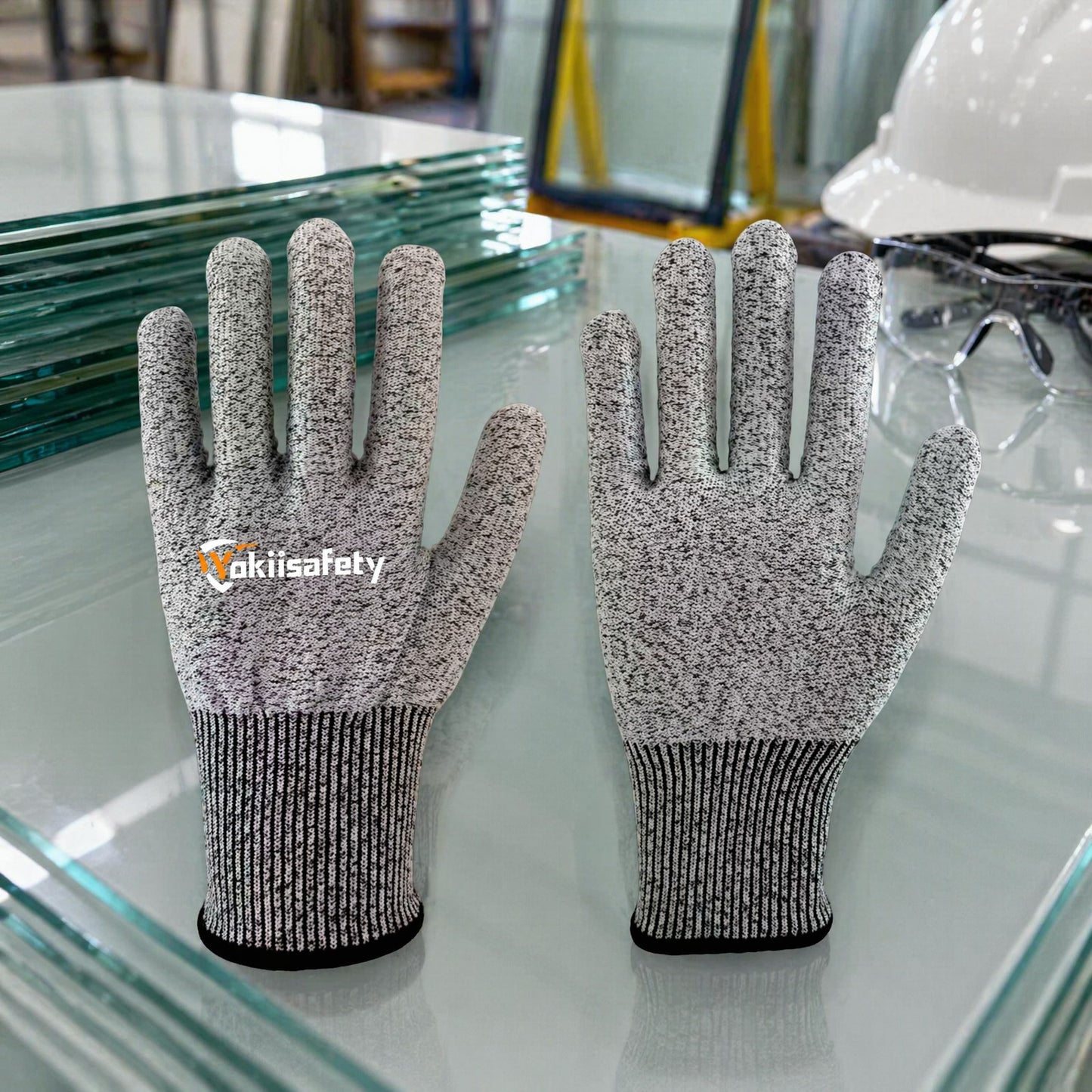 Cut resistant safety gloves at glass handling workstation - industrial hand protection for sharp material handling